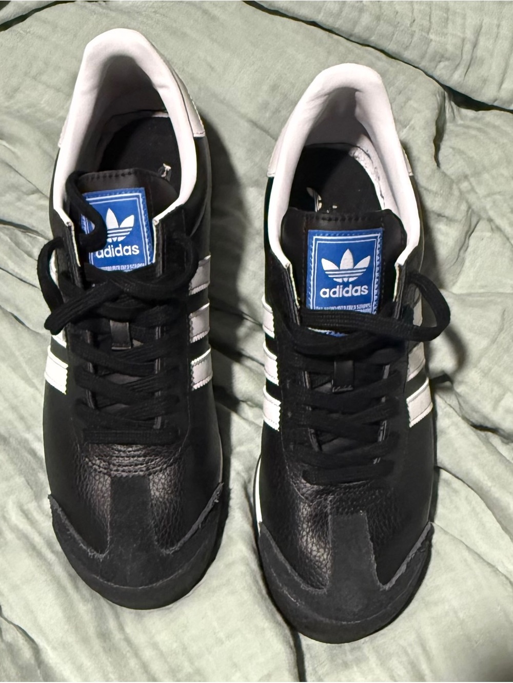 adidas Black Sneakers with White Stripes and Blue Logo Patch